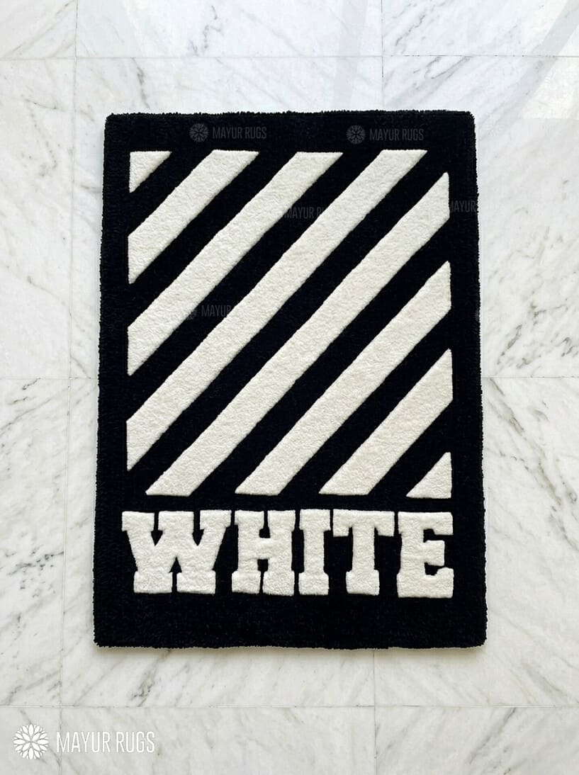 White stripe graphic hand tufted wool rug featuring bold monochrome geometric artwork by Mayur Rugs.