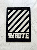 White stripe graphic hand tufted wool rug featuring bold monochrome geometric artwork by Mayur Rugs.