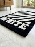 White stripe graphic hand tufted wool rug featuring bold monochrome geometric artwork by Mayur Rugs.