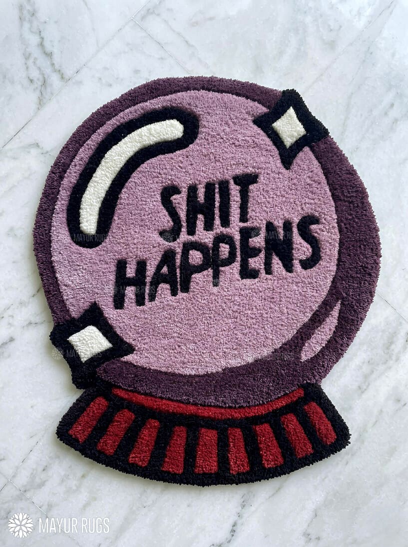 Shit Happens custom hand-tufted wool rug featuring a funny crystal ball quote design by Mayur Rugs.