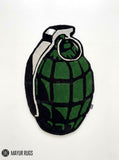 Grenade hand tufted custom wool rug featuring military tactical artwork with olive green grenade design by Mayur Rugs.