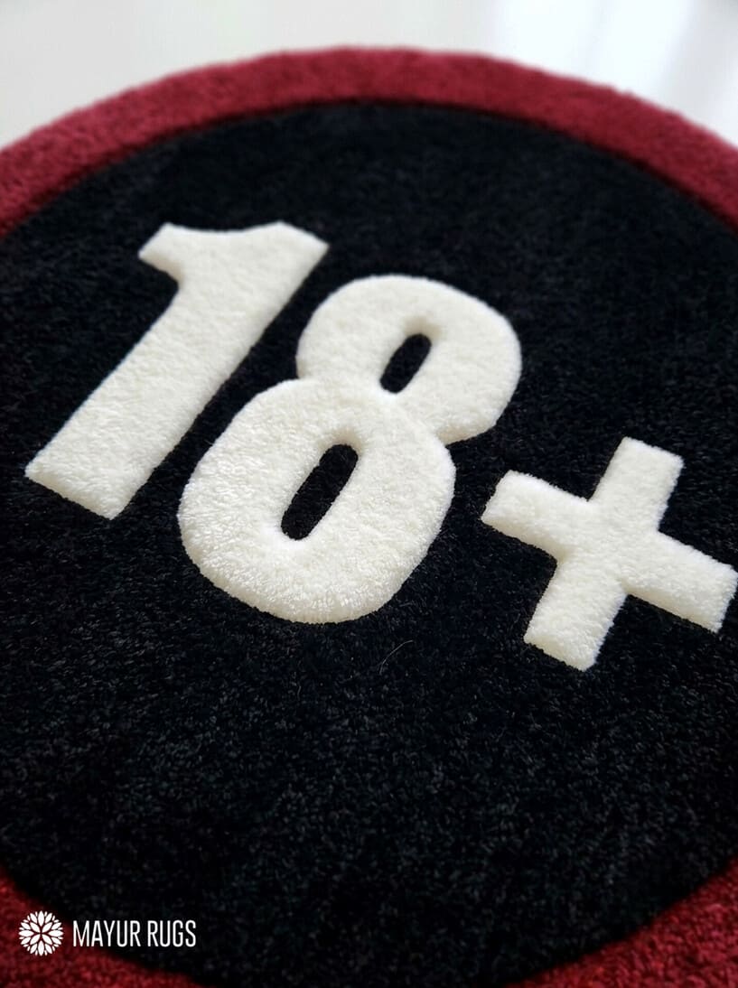 18+ warning sign hand-tufted rug handmade in India by Mayur Rugs featuring a bold circular graphic design for gaming rooms and modern décor.