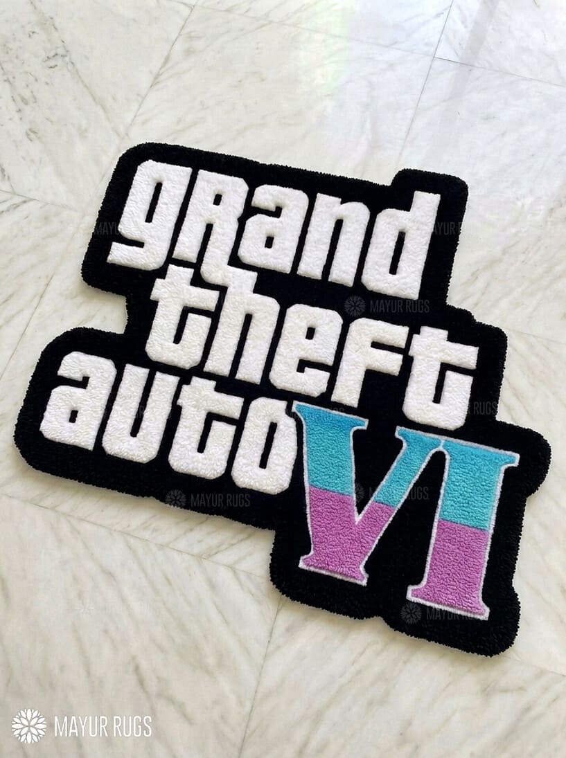 Grand Theft Auto VI hand-tufted logo rug handmade in India by Mayur Rugs featuring bold gaming typography and pastel VI design.
