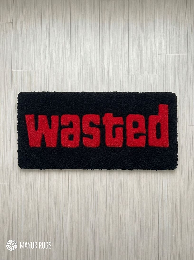 Wasted GTA inspired hand tufted keyboard rug featuring iconic gaming typography by Mayur Rugs.