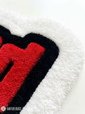 Wasted hand-tufted statement rug handmade in India by Mayur Rugs featuring bold gaming-inspired typography in red, black, and white.