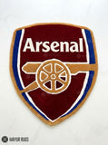 Arsenal hand-tufted custom rug featuring the Arsenal football crest, cannon design, red and blue colors, handmade from premium New Zealand wool by Mayur Rugs.