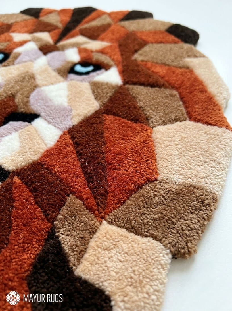 Geometric lion head hand-tufted rug handmade in India by Mayur Rugs featuring a modern low-poly wildlife design with earthy tones and premium wool craftsmanship.
