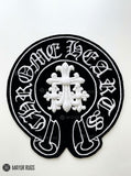 Chrome Hearts inspired gothic 3D hand-tufted custom wool rug featuring Old English lettering, gothic cross artwork, and black and white streetwear styling by Mayur Rugs.
