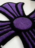 Chrome Hearts inspired purple gothic cross hand-tufted custom wool rug featuring raised sculptural detailing, a black outline, and Y2K streetwear styling by Mayur Rugs.