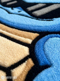 Cool Squirtle Squad hand-tufted custom wool rug featuring a blue Squirtle character wearing black sunglasses with a tan shell and curled tail by Mayur Rugs.