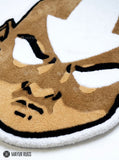 Aang inspired Avatar hand-tufted custom wool rug featuring a bald anime character with a white forehead arrow, expressive eyes, and detailed tan and brown artwork by Mayur Rugs.