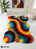 Wavy abstract hand-tufted 3D wool area rug featuring colorful sculptural curves and organic shapes in red, yellow, blue, orange, teal, charcoal, and navy by Mayur Rugs.