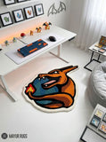 Charizard inspired Pokémon hand-tufted custom wool rug featuring an orange dragon-like character with blue wings, red flame details, sharp teeth, and sculpted 3D artwork by Mayur Rugs.