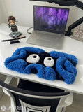 Tangela inspired Pokémon 3D hand-tufted keyboard rug featuring a blue tangled-vine character design with large white eyes and raised plush detailing for gaming and anime desk décor by Mayur Rugs.