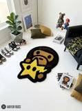 BAPE Baby Milo inspired hand-tufted custom wool rug featuring a brown ape character with bold black outlines and a yellow star accent for streetwear and hypebeast décor by Mayur Rugs.