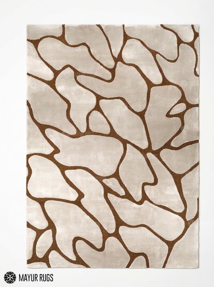 Organic pebble abstract silk and wool hand-tufted area rug featuring irregular cream and beige forms with flowing brown outlines in a neutral modern design by Mayur Rugs.