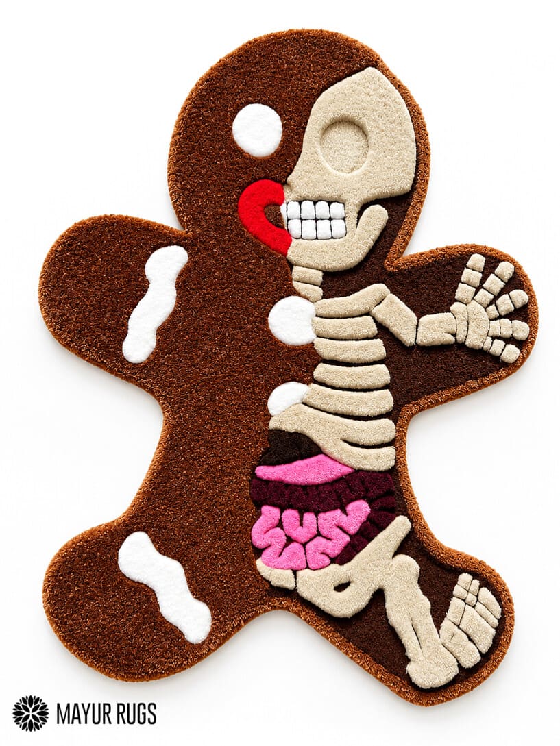 Gingerbread-shaped custom hand-tufted rug featuring a cream skeleton illustration, brown body, pink anatomical details, and red accents by Mayur Rugs.