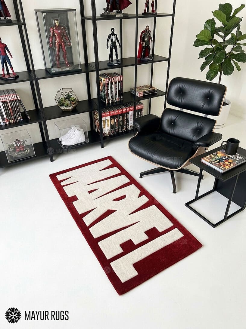 Marvel inspired hand-tufted wool area rug featuring oversized cream-white comic book lettering on a deep red background for superhero and pop-culture décor by Mayur Rugs.