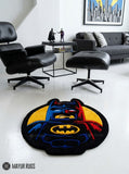LEGO Batman inspired 3D hand-tufted custom wool rug featuring a black, blue, red, and yellow superhero character design with pointed bat ears, cape details, and a raised bat emblem by Mayur Rugs.