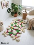 Blooming garden 3D hand-tufted wool area rug featuring raised cream-white flowers with golden centers over a vibrant pink and green organic botanical pattern by Mayur Rugs.