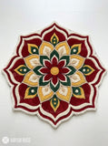 Festive rangoli-inspired hand-tufted floral mandala rug in maroon, mustard yellow, green and ivory with a scalloped flower shape by Mayur Rugs.