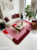 Pink Mirage abstract area rug featuring pink, red, burgundy, and ivory curved geometric shapes in a contemporary color-blocked design by Mayur Rugs.