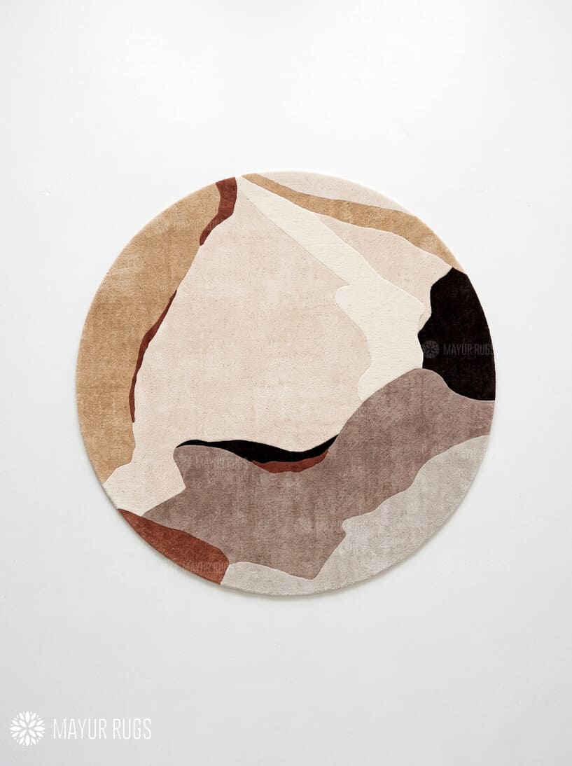 Round abstract area rug featuring flowing organic shapes in beige, ivory, taupe, chocolate brown, and rust tones by Mayur Rugs.