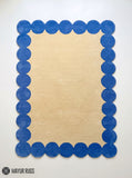 Rectangular beige hand-tufted area rug made with premium New Zealand wool and silk, featuring a bold royal blue border of repeated rounded scalloped shapes by Mayur Rugs.