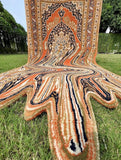 Decorative rug with a unique design on grass